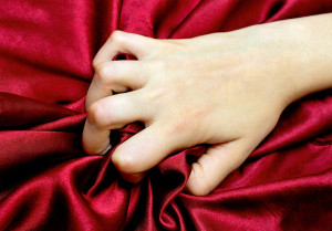 bigstock-woman-s-hand-holding-a-satin-s-26363675